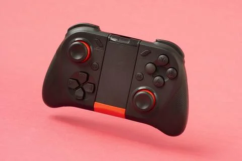 Video game controller on the pink background Stock Photos
