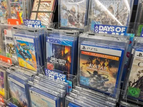 Video Game Display Featuring Popular Titles for PS4 and PS5 Stock Photos