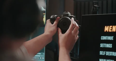 Video game live streamer adjusting microphone, camera, and stream Stock Footage 306199599