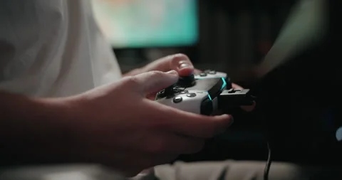 Video game live streamer’s hands using a controller Stock Footage 306199650
