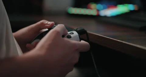 Video game live streamer’s hands using a controller Stock Footage 306199654