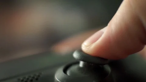 Video game playing focus on the controllers thumbstick closeup shot1 Stock Footage 115932207