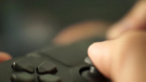 Video game playing focus on the controllers thumbstick close up shot3 Stock Footage 115932398