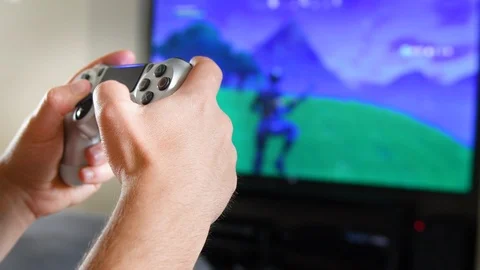 Video games, close up of man's hands and controller Stock Footage 92243885