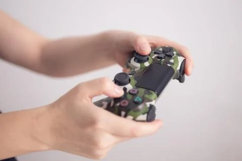 Video games wireless playing controller joystick in woman's hands Stock Photos