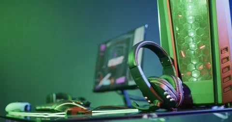 Video of gaming computer and gaming equipment on desk with copy space on neon Stock-Footage 246854662