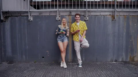 Video of generation z couple spending time outdoors in the city online. Video stock 259880863