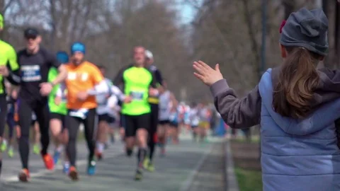 Video of giving runners high five in real slow motion Stock Footage 75244938
