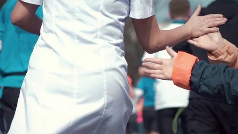 Video of giving runners high five in real slow motion Stock Footage 83586651