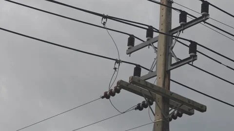 Video of a glowing electrical arc sparking at a hotline clamp connection. Stock Footage 339049290