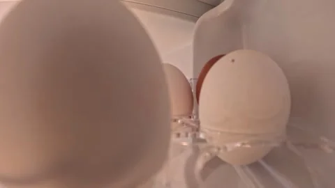 Video of grabbing some eggs out of the fridge. Видео 332800405