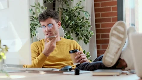 Video of graphic designer working with computer while using smartphone and dr Stock Footage 167079620