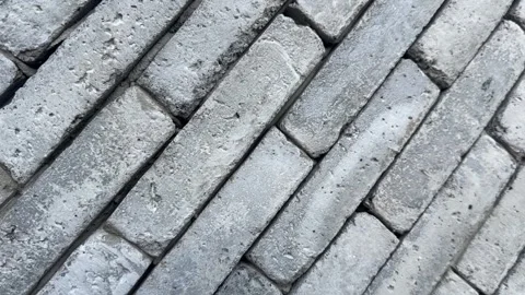 Video of gray brick blocks stacked diagonally with rough textures Stock Footage 318711425