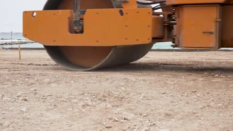 Video ground level of steamroller compacting the soil in the construction site Stock Footage 161268066