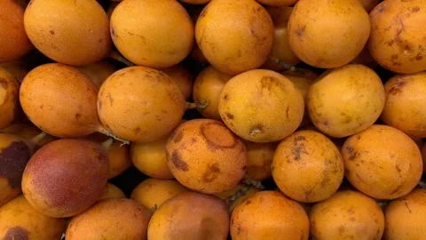 Video of a group of passion fruit in a local market. Fruit and food concept. Stock Footage 256054207