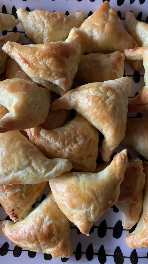 Video of group of small pies - snacks. Concept of food at events. Видео 255627865