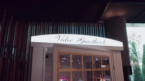 Video Guestbook Booth with Script Signage at a Wedding Reception Venue Video stock 343697601