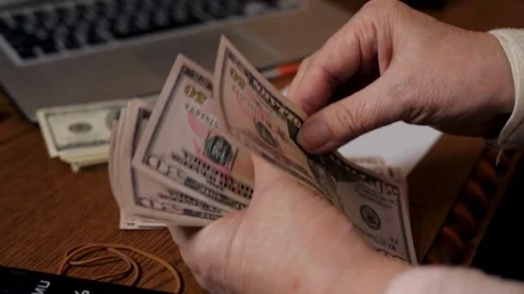 Video of hands counting cash of dollar US banknotes. Concept of investment, Stock-Footage 336263204