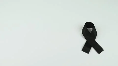 Video of Hands placing a black ribbon Stock Footage 231484826