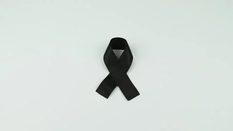 Video of Hands placing a black ribbon Stock Footage 231484847
