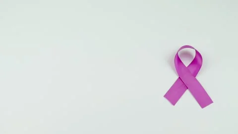 Video of Hands placing a pink Ribbon. Stock Footage 231484896