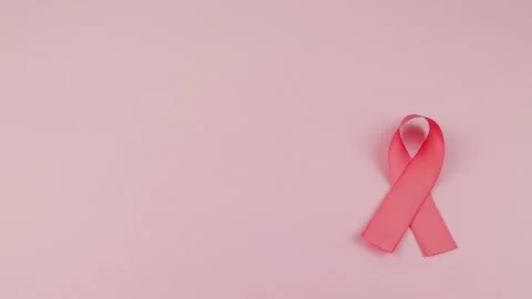 Video of Hands placing a pink Ribbon Stock Footage 231484911