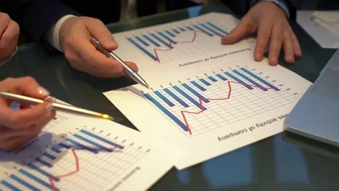 Video of hands pointing at business document during discussion at meeting. Stock Footage 84388917