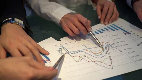 Video of hands pointing at business document during discussion at meeting. Stock Footage 84389654