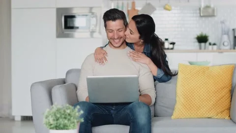 Video of happy beautiful couple using their laptop to searching voyage whil.. Stock Footage 227887911