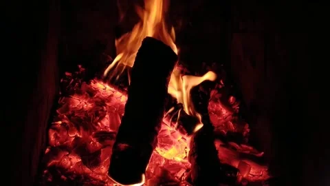 Video of the heat from the fire in the fireplace in cold autumn Stock Footage 201341482