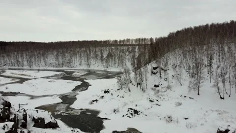 Video from the height of two hikers guy and girl stand on top of a slope Stock Footage 151090494