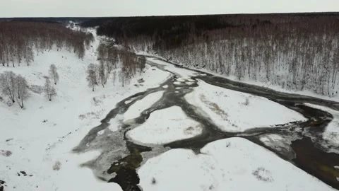 Video from the height of a winter mountain snow-covered river. Journey Stock Footage 151090529