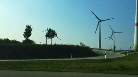 Video of highway with wind turbines in the background Video stock 71767958