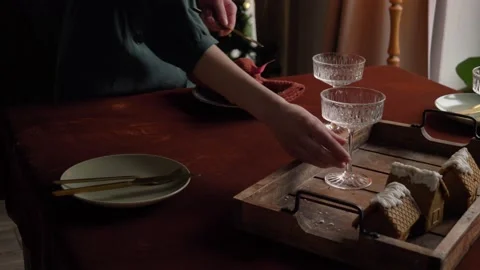 Video how woman set a table for Christmas dinner Stock Footage 165179848