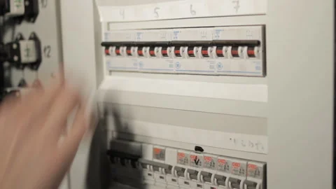 Video of a human switching off electricity by pushing the levers Stock Footage 233448090