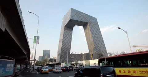  video of the iconic Beijing CCTV headquarters and busy freeway Stock-Footage 52528701