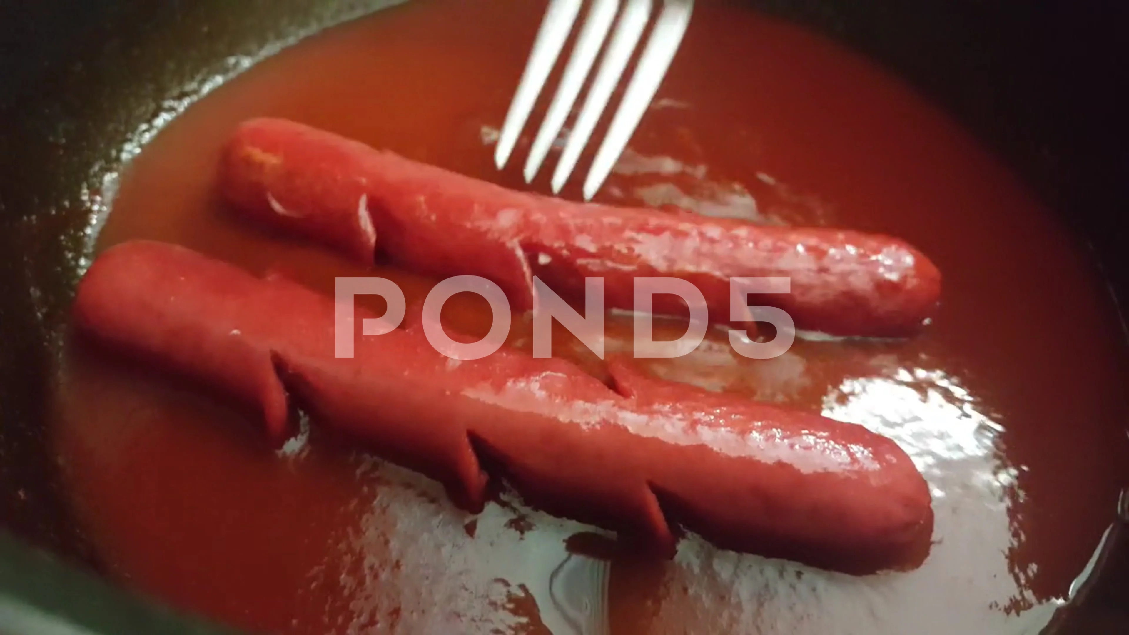 Video image of homemade hot dogs in the pot