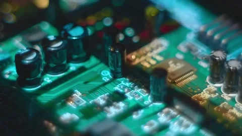 The video image is projected on printed circuit board with electronic component Stock Footage 313221061