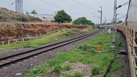 Video of an Indian local passenger train or express train changing tracks a.. Video stock 313381507