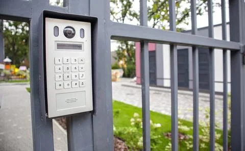 Video intercom on the gate at the entrance to the residential area. Electroni Stock Photos