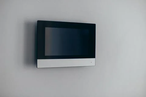 A video intercom screen on a white apartment wall Stock Photos