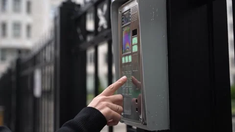 Video intercom. A woman's hand dials the code for an intercom call Stock Footage 258001246