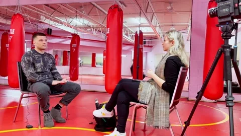 Video Interview Setup Inside Boxing Gym With Heavy Bags Stock Footage 335203346