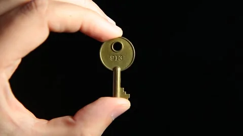 Video of key hand dark background Stock Footage 245278732