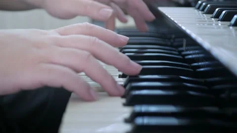Video to the keyboard of piano while using fingers hand playing classic music Stock Footage 203735942