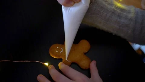 Video of kids making and decorating gingerbread Christmas cookies. Family in Stock Footage 220057545