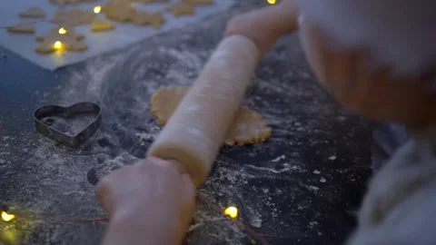 Video of kids making and decorating gingerbread Christmas cookies. Family in Stock Footage 220057580