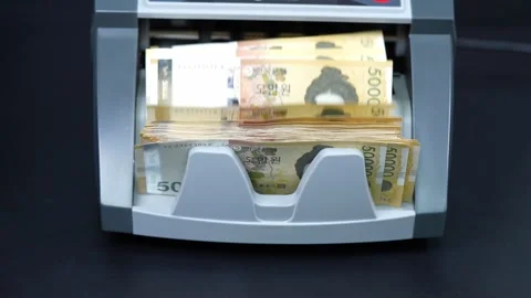 Video of Korean banknotes being counted by a money counter Stock Footage 322001632