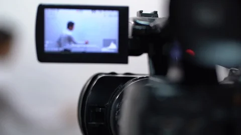 The video lessons on English language, Camera operator working with a cinema Stock Footage 107864331