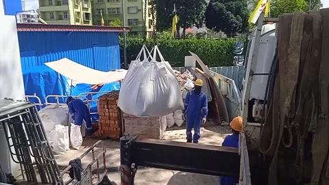 Video of Lifting White Sacks Filled with Sand to Project Site with Crane Stock Footage 304610409